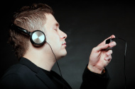 young-man-with-headphones-use-mp3-music-player